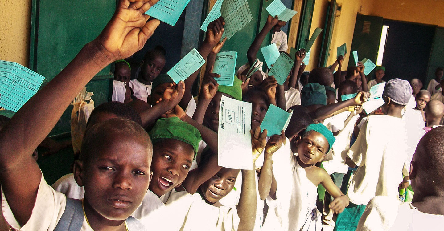 School children holding immunisation cards in Nigeria. It is one of 21 countries that have launched meningitis A campaigns with support from Gavi.   Credit: Gavi/2011/Ed Harris
