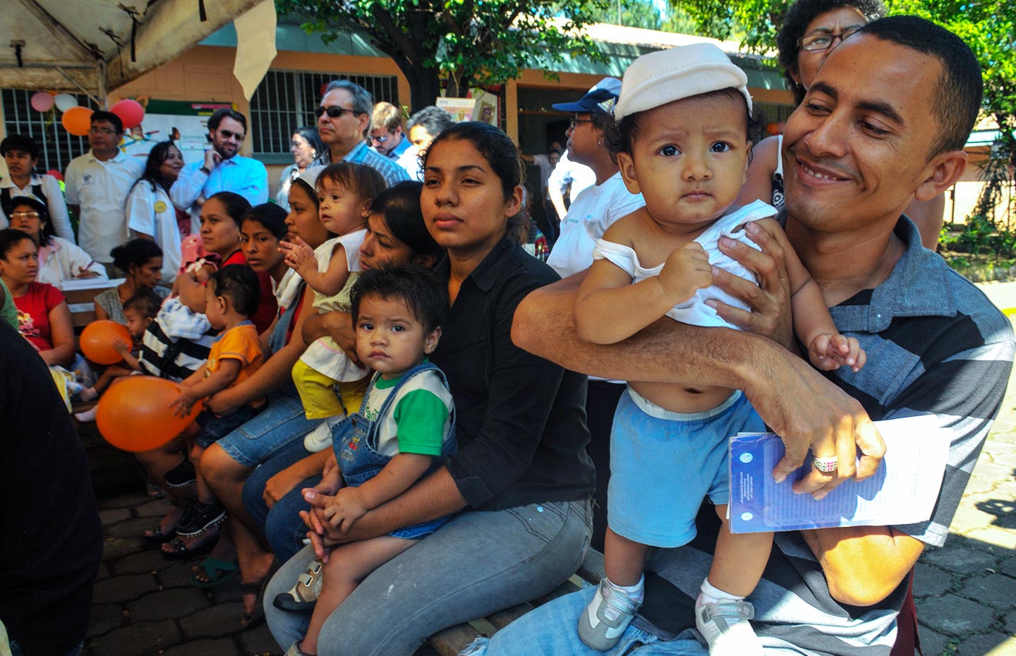 Father with his son during a vaccination session in Nicaragua - GAVI/2010/German. A Miranda