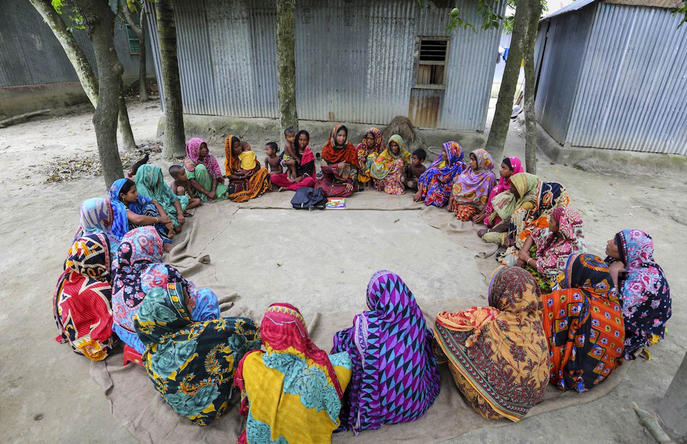 Health worker and pregnant women sitting in a circle in Bangladesh. Credit: Gavi/2014/GMB Akash.