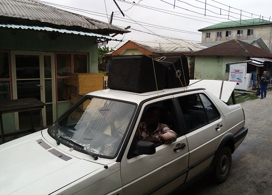 One of the vehicles with loudspeaker mounted on top used for creating awareness of the vaccine. Photo: Simon Utebor 