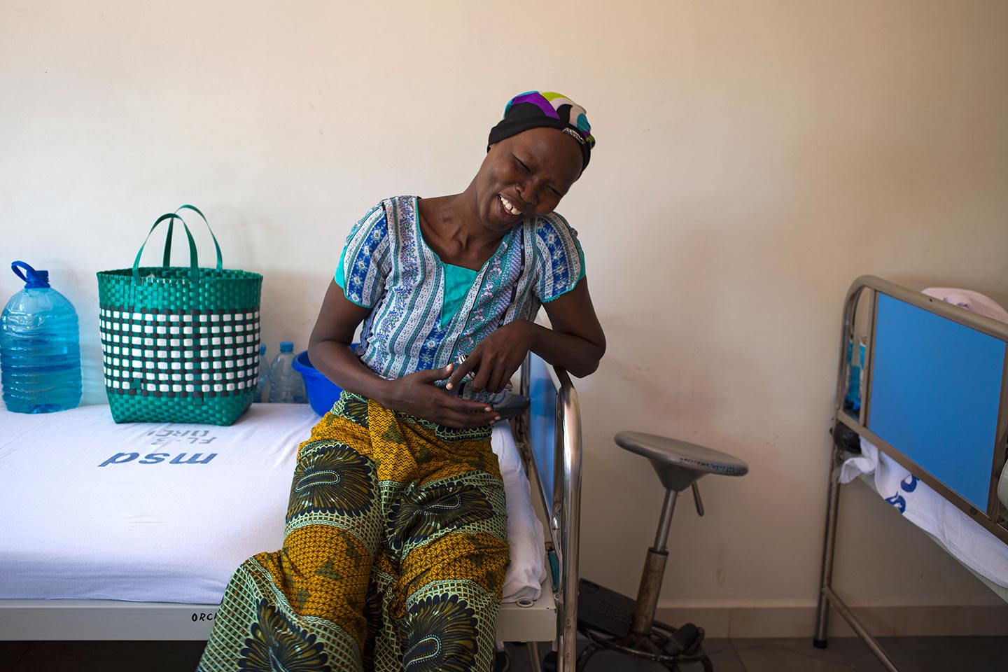 Cervical cancer patient Flora Jacobs poses with her head scarf to cover her hair loss at the Ocean Road Cancer Institute in Dar es Salaam. – Credit: Gavi/2014/Karel Prinsloo