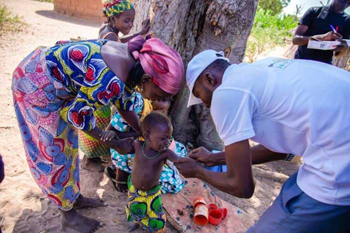 An eligible child receiving a vaccine during an immunization campaign in Borno State, Nigeria. Credit: WHO