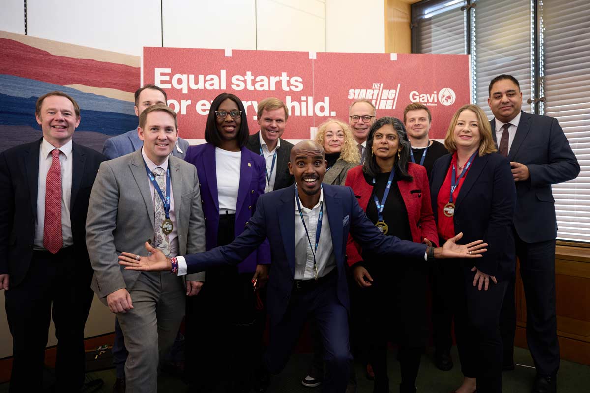 British Olympic champion Sir Mo Farah, front and centre among UK MPs and Björn Gillsäter, Managing Director, Global Donor Relations, Advocacy and Fundraising, Gavi, at the cross-party parliamentary event in London. Credit: Tom Shaw/2024.