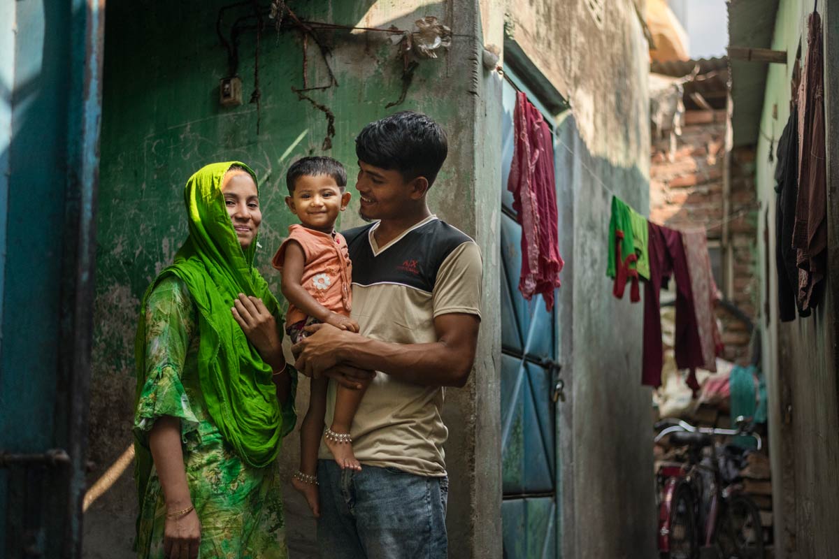 A family standing outside in Dhaka, Bangladesh. Credit: Gavi/2023/A Arefin