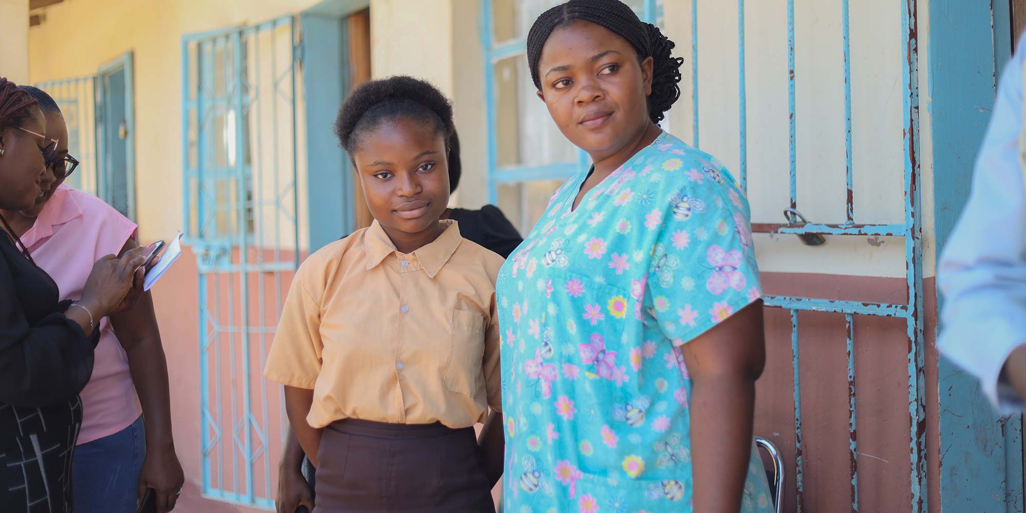 Mirriam Sikaputa, a 26-year-old registered nurse, vaccinating girls at the David Hamushu School in Kabwe. With Miriam, is the young champion, 13-year-old Mirriam Botha smiling after receiving her HPV vaccine. UNICEF/2023/Mapalo Mwenya