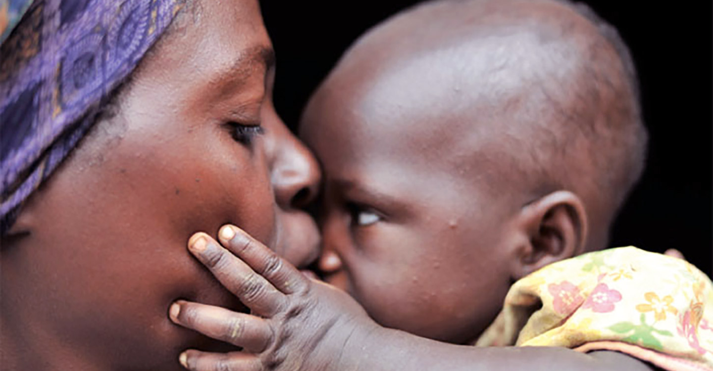 Mother and child facing each other