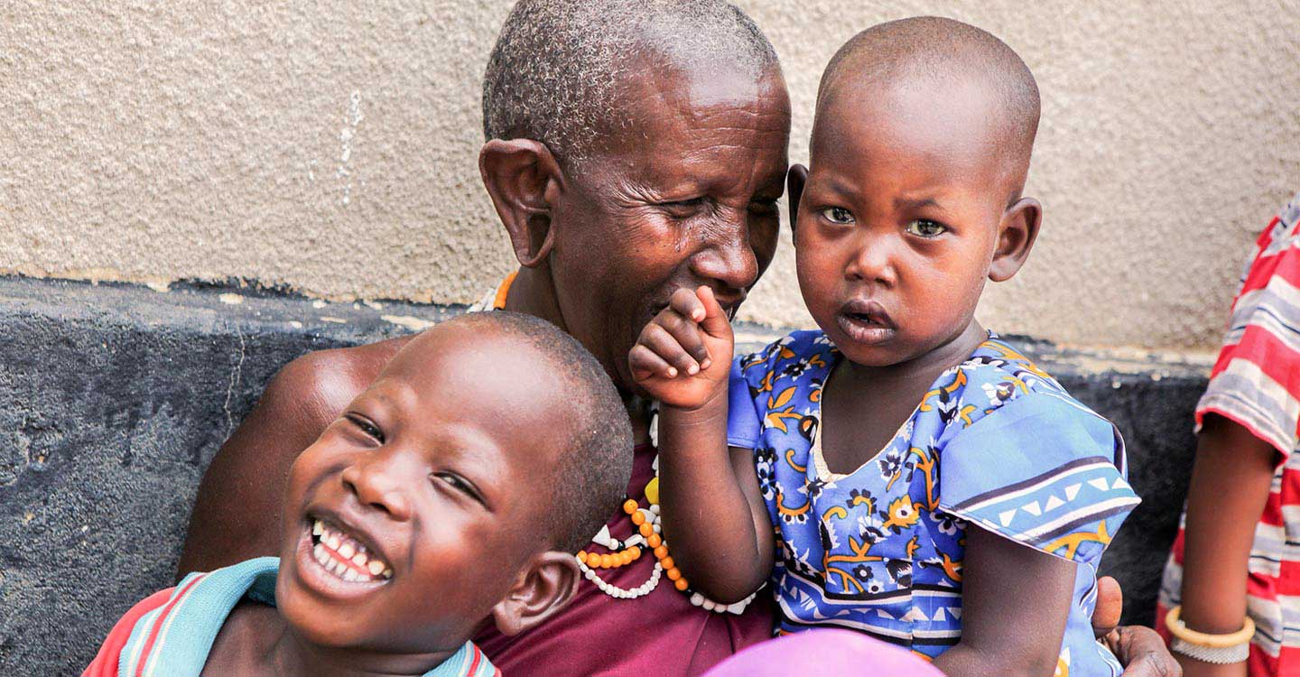 A mother laughing with her children
