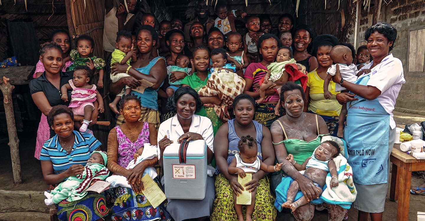 Health workers and locals in Nigeria. Credit: GAVI/2013/Adrian Brooks.
