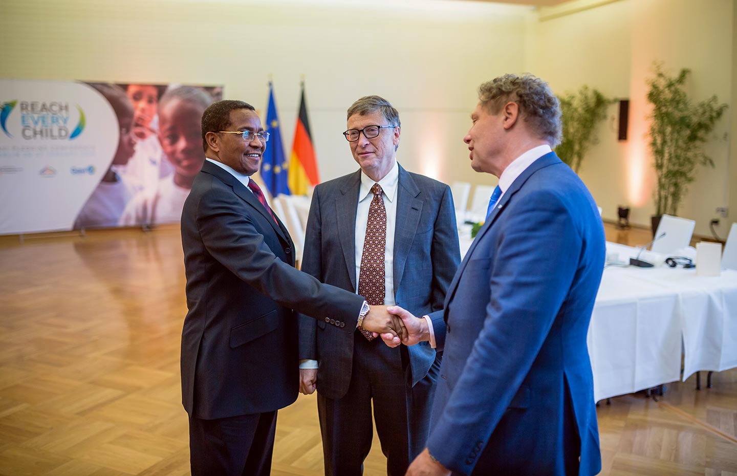 (L-R) Bill Gates, co-chair of the Bill &amp; Melinda Gates Foundation, looks on as Global Ambassador for immunisation and former President of Tanzania Jakaya Kikwete (L) shakes hands with Gavi CEO Seth Berkley. Credit: Gavi/BMZ/2015/Stefan Zeits.