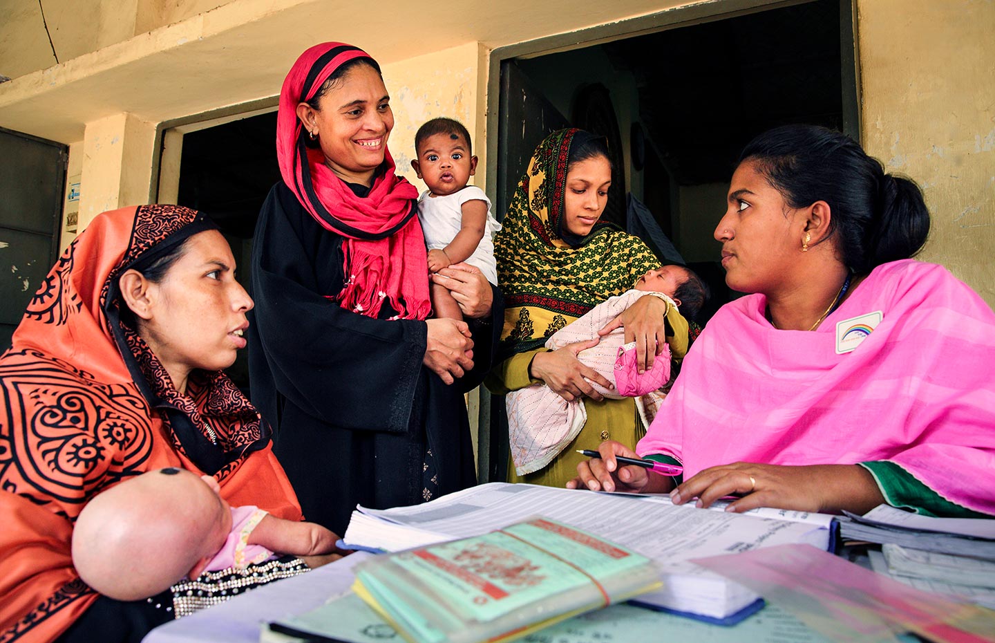 Gavi/GMB Akash- Parents attend the vaccine session at the EPI centre in Dhaka, Bangladesh