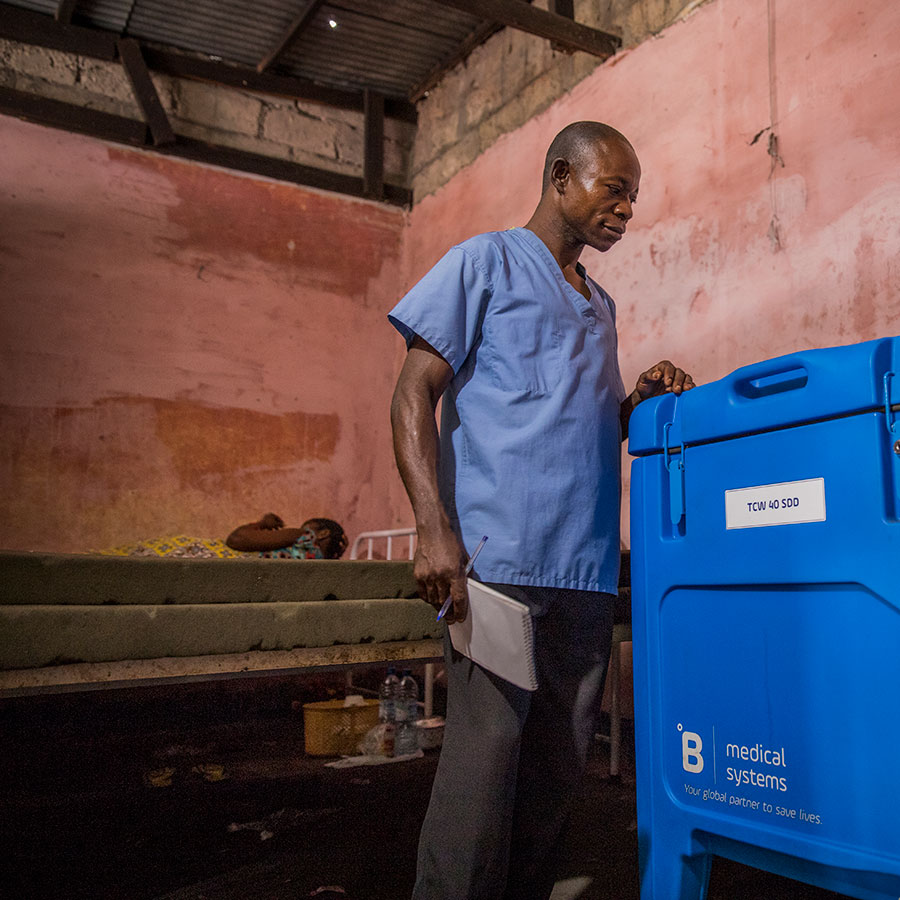 Victor with new solar-powered fridge. Photo credit: Gavi/2018/Thomas Nicolon