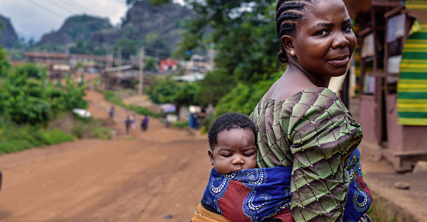 Mother with baby on her back in Nigeria