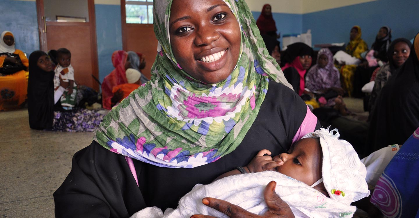 Mother holding a newborn in the hospital