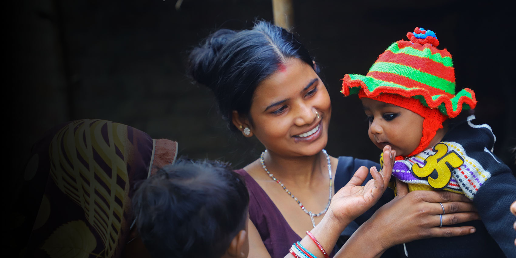 Mother smiles as she holds her baby- GroupM/Sagar Pratap/2018