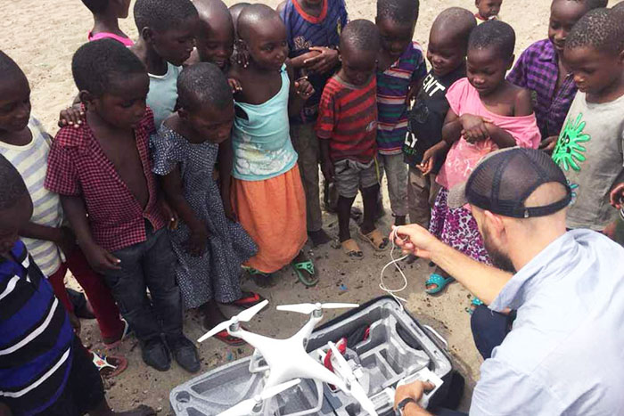 Children from Juma Island in Mwanza, Tanzania look on during a UAV deployment. Photo credit: inSupply/JSI. Children from Juma Island in Mwanza, Tanzania look on during a UAV deployment. Photo credit: inSupply/JSI.