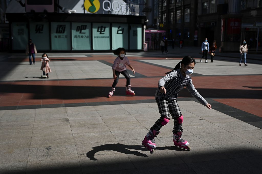 Image from NYTimes article – Children played outside a mall in Beijing on Tuesday. Credit...Wang Zhao/Agence France-Presse — Getty Images Image from NYTimes article – Children played outside a mall in Beijing on Tuesday. Credit...Wang Zhao/Agence France-Presse — Getty Images