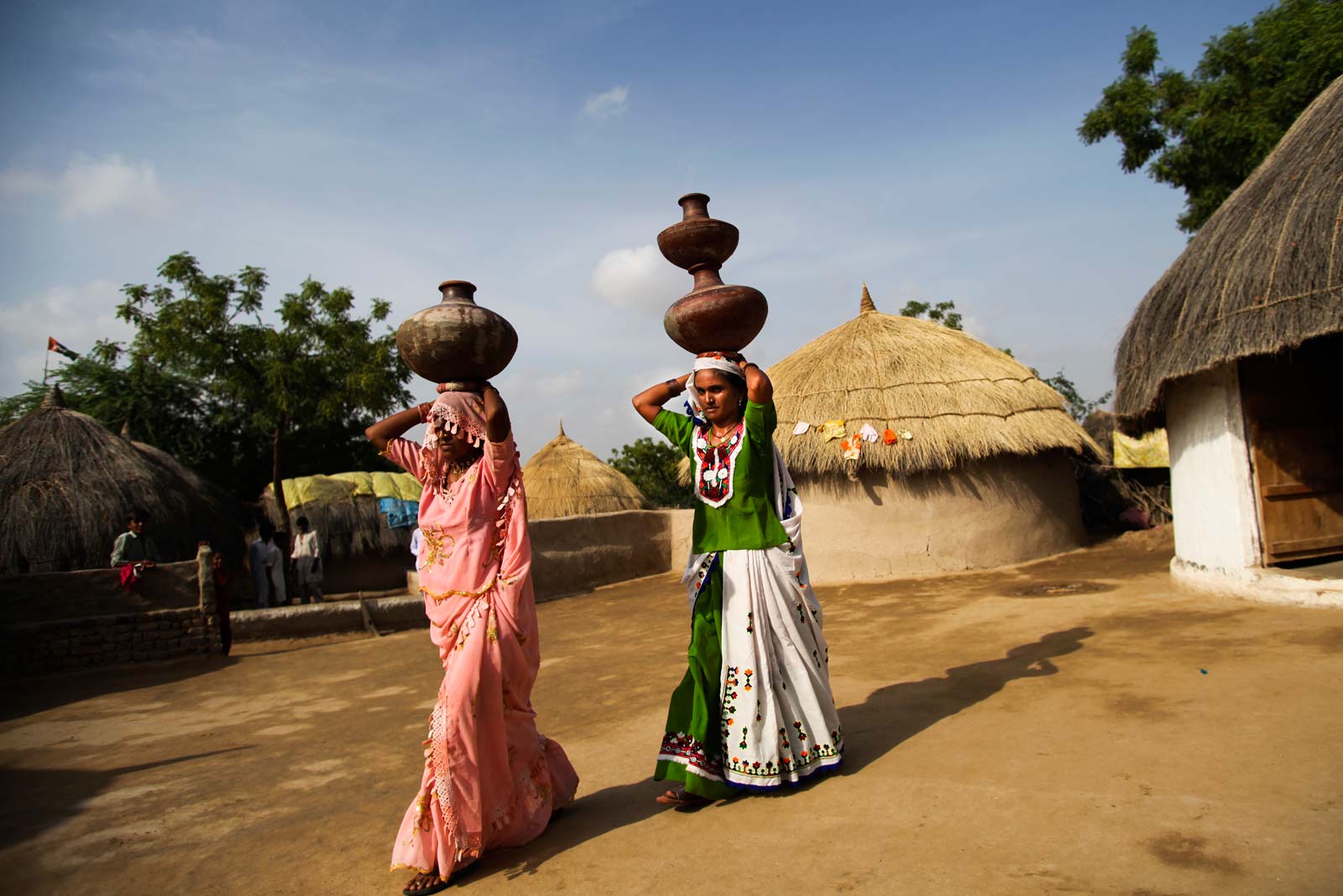  Bai and one of her friends return from a trip to the village well after drawing the water needed to meet their families’ daily needs. In a country where vaccines are widely available but only half of children are fully immunised, a great deal rests on the shoulders of Bai and her fellow Lady Health Workers.