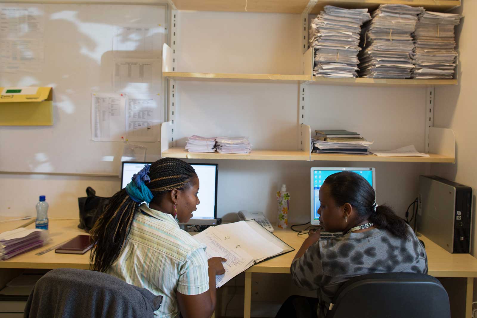  Data clerks at KEMRI, the Kenya Medical Research Institute, input medical data for the PCV impact study. The computers are connected to an expanding database of over a quarter of a million residents of the Kilifi Health and Demographic Surveillance System, including almost 50,000 children aged under five.