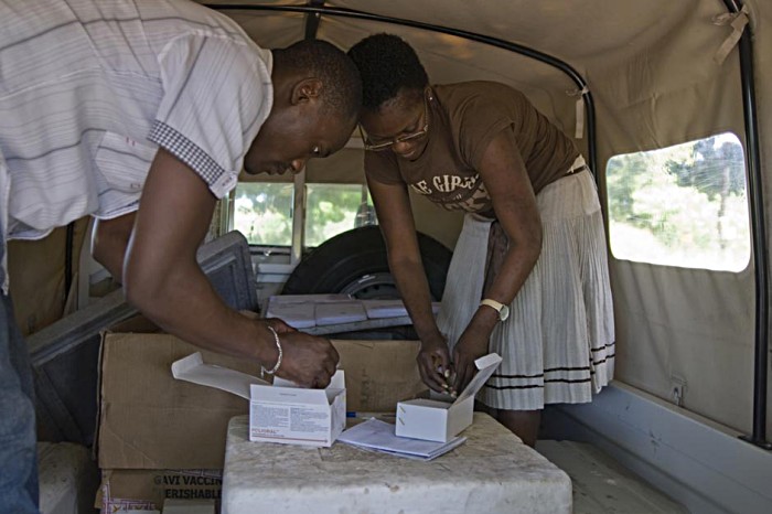 The vaccines are then loaded into a health ministry Land Rover. With temperatures in excess of 30 degrees, the precious cargo is stored in a large cold box packed with ice.