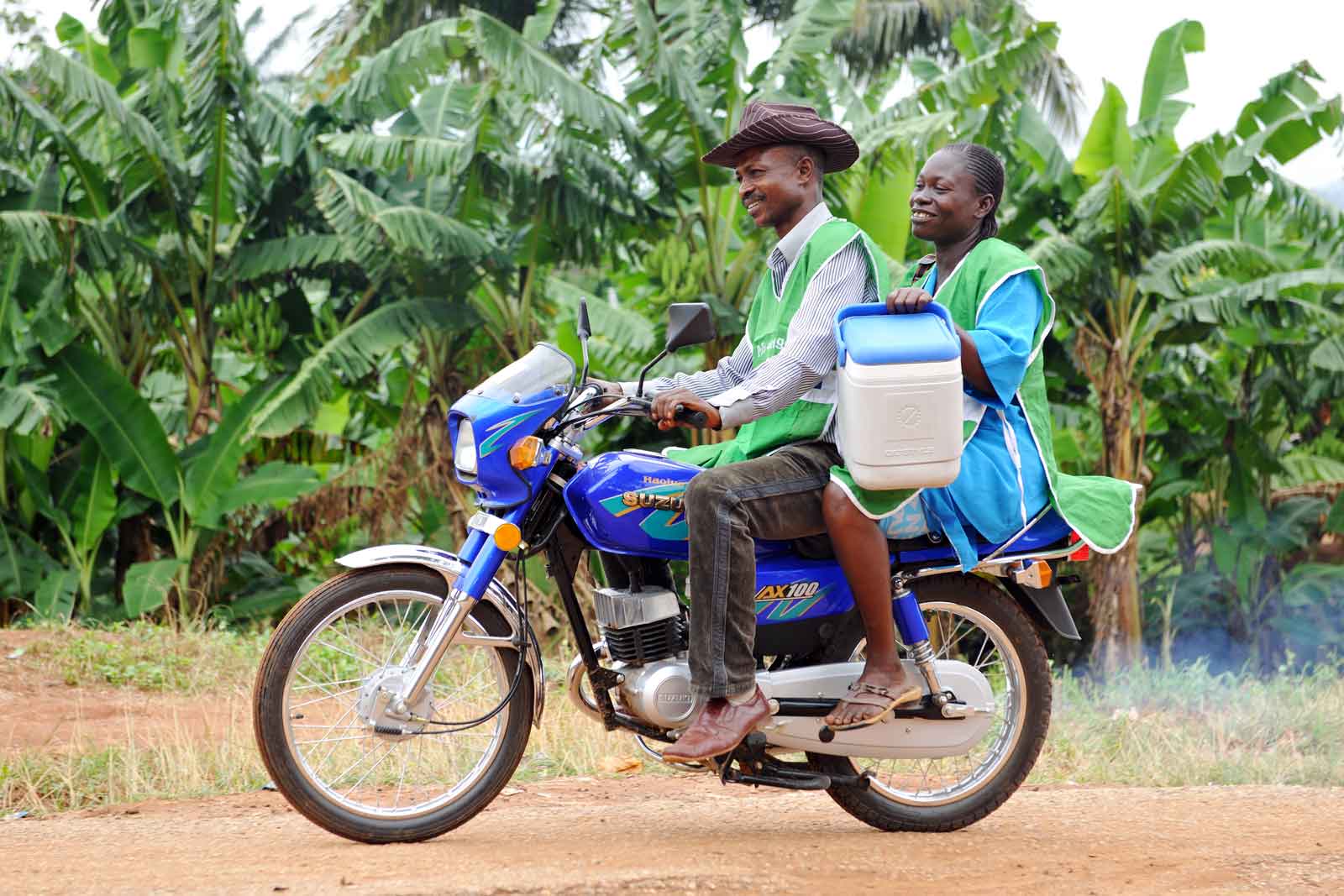  Immunisation outreach nurse Agnes Akinbiodun and health worker Gabriel Ikoro travel by motorbike for the first leg of their journey to deliver vaccines to remote communities in Ondo State. In a second step, they hike and scale boulder- strewn countryside to reach the villages.