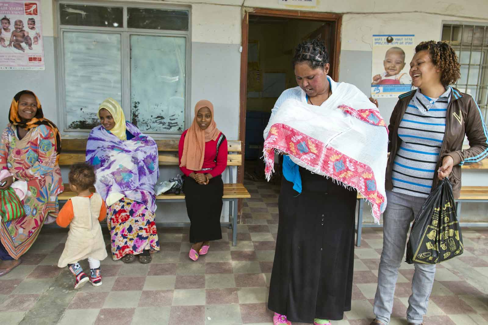 In Addis Ababa, where 94% of children have received basic vaccines, mothers wait to have their children immunised at the Kazanchis Health Centre.