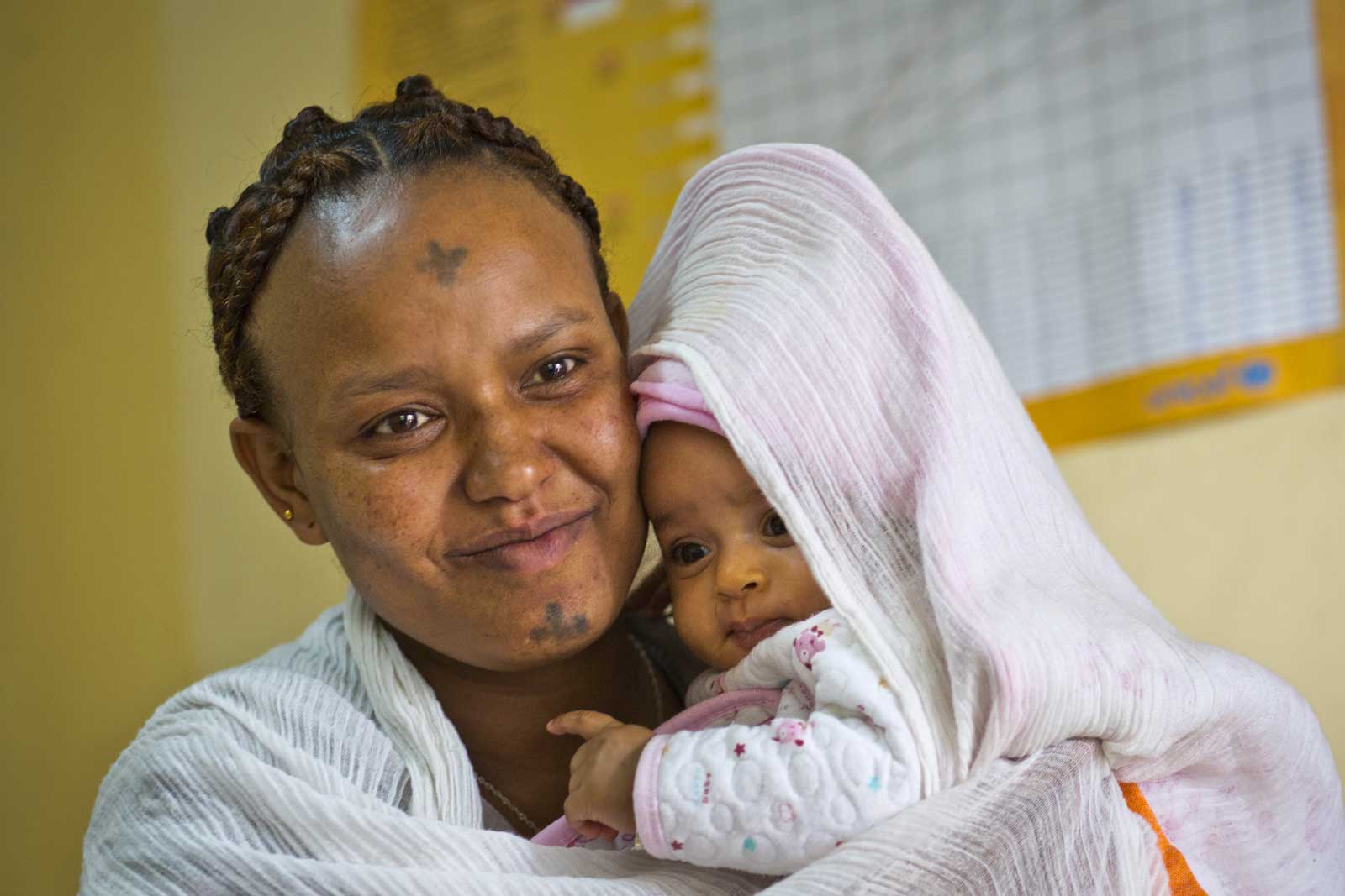  Few of the women attending the clinic have more than a primary school education, but all are fully aware that vaccination is important, say the centre’s staff. “I never miss a vaccination,”says Meles Nebebe as she comforts her daughter Samrawit Getu.“I want my child to be free from diseases.”