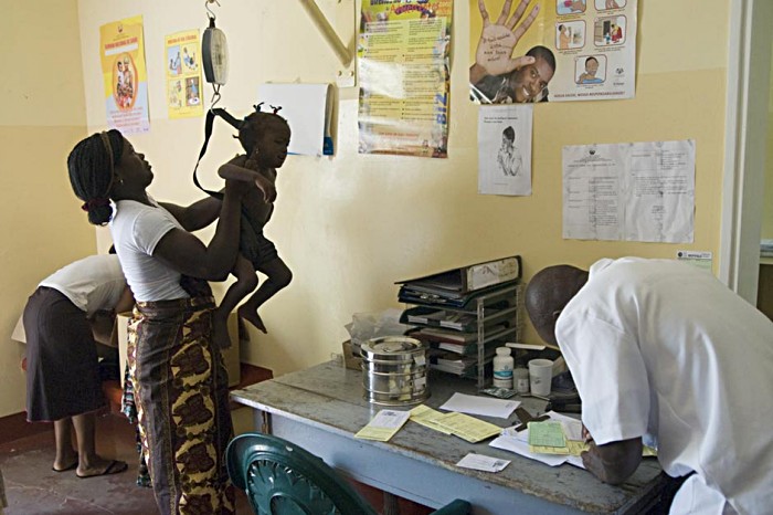 Loria Albino, aged two-and-a-half, has her weight checked. Like their counterparts in developed countries, Manhica’s local health workers take advantage of vaccination clinics to check-up child and maternal health.