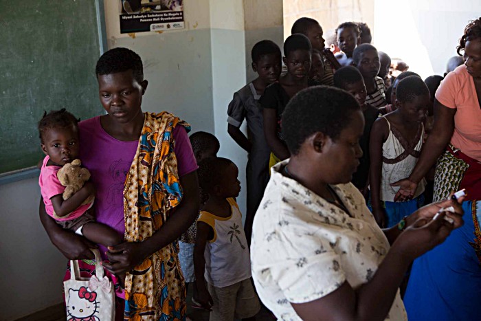 Malawi’s health workers played a frontline role in informing parents about the campaign, alongside other social mobilisation tactics. Liana Jere brought her nearly two-year-old daughter Nelia to be immunised after hearing a radio broadcast.