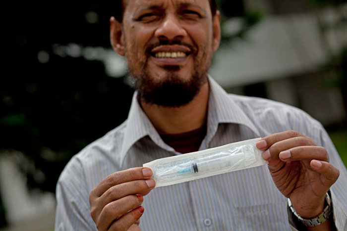 Dr Tajal Islam A. Bari, Assistant Professor Maternal and Child Health at the Ministry of Health shows-off the auto-disposable syringe (AD) used to deliver all vaccines in Bangladesh. Since GAVI stopped supplying AD’s in 2007, the Health Ministry has procured its own safe syringes from South Korea.
