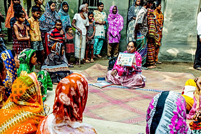 A healthcare worker in Bangladesh educates parents from a rural area about the importance of immunisation. A critical part of the success of immunisation campaigns is generating demand – engaging with communities to ensure parents trust the safety and efficacy of vaccines and are motivated to make sure their children complete recommended immunisation schedules on time.