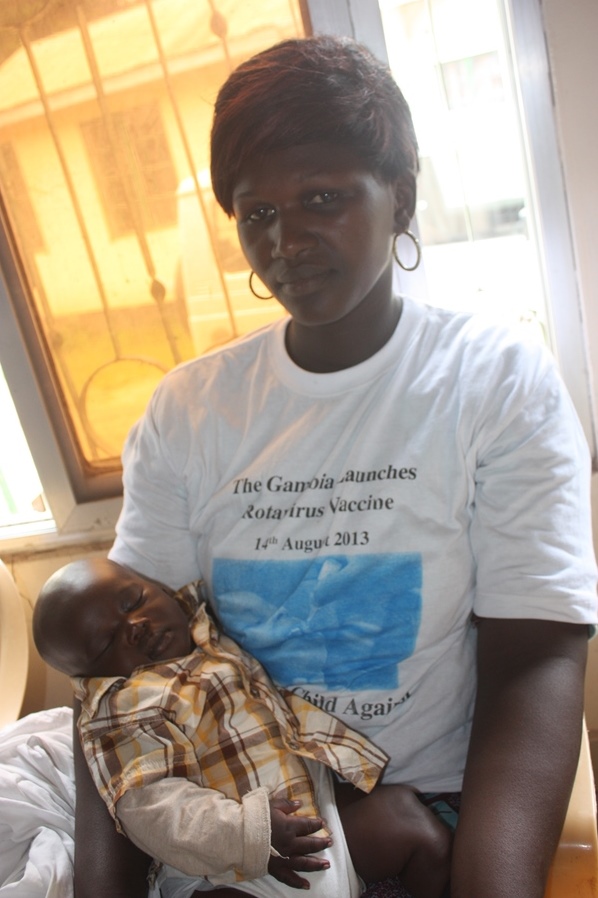 At the special launch ceremony organised by the Health Ministry, mother Jabou Camara waits for her two-month-old son to be immunised. Severe diarrhoea caused by rotavirus infection claims the lives of more than 450,000 African children every year --  more than 50% of all global rotavirus deaths.