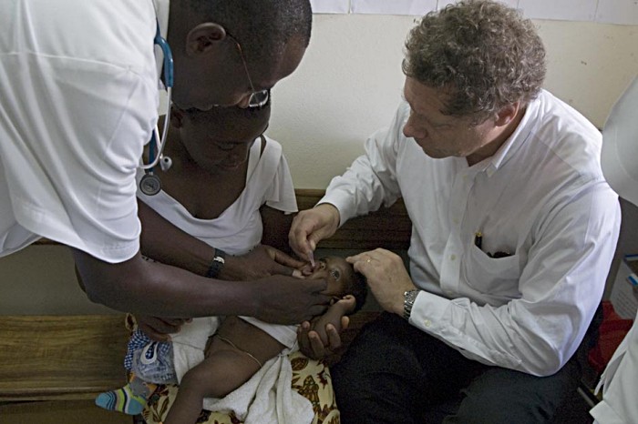 Seth administers the polio vaccine to Armilia Silva. Her 22-year-old mother Magdalena, who has two other daughters, walked for one hour to reach the clinic.