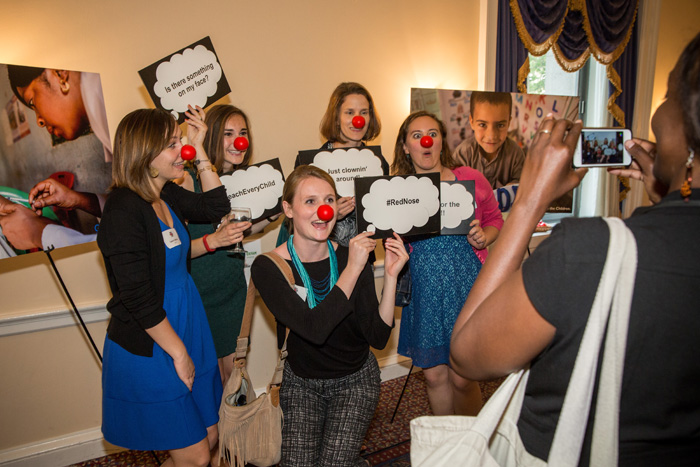 Guests enjoy the Red Nose Day photo booth