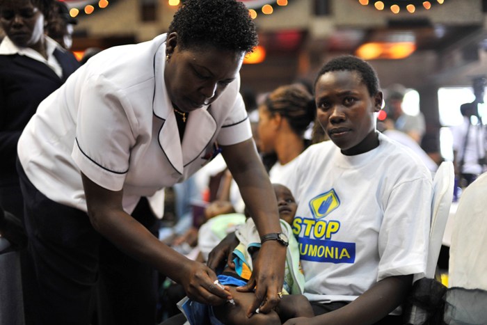 Mary Wambui looks on as a nurse delivers the first of three pneumococcal vaccine doses to her daughter Esther Nyambura. The scene will be repeated countless times oin health clinics across the country, as Kenya targets 85% pneumococcal vaccine coverage by 2012.