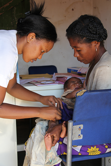 Hantamalala Ramanandraibe immunises a child with a GAVI-supported vaccine, the pentavalent vaccine, at the health post in Ankariera. Vaccine-preventable diseases kill 1.7 million children every year, accounting for roughly 20% of all under five child mortality.