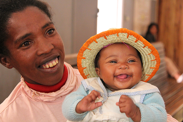 Eulalie Rasoarlalao and her four-month-old baby girl, Francia, smile for the camera following immunisation at a health point in Isotry, Antananarivo.