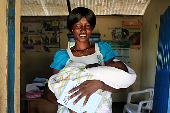 South Sudan: Two days after the pentavalent vaccine was introduced in her country in July 2014, Jackline Juan cradles her daughter Keji Francis after the baby's first dose. As the 73rd and last GAVI eligible country to introduce the vaccine, South Sudan marked an important milestone in the mission to protect children from these preventable illnesses. 