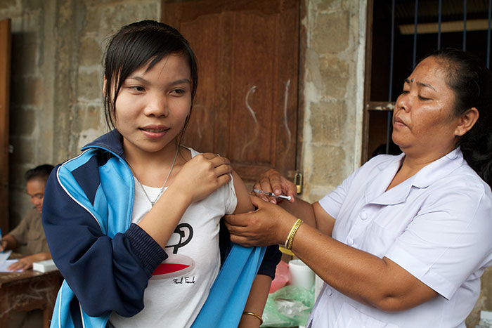 Girls approaching child bearing age must be reached with the MR vaccine, as rubella infection in pregnant women can cause severe birth disorders in newborns. These include heart disease, blindness and deafness. This girl receives her vaccine at Kang Village School in Pakse District, southern Laos.
