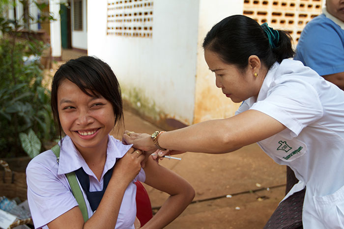 A young woman receives immunisation against measles and rubella during an immunisation campaign in Laos, November 2011. The rubella virus can lead to miscarriage, still births, or birth defects when passed from mother to child during pregnancy. An estimated 90,000 birth defects, known collectively as congenital rubella syndrome (CRS), happen every year in the world’s poorest countries.