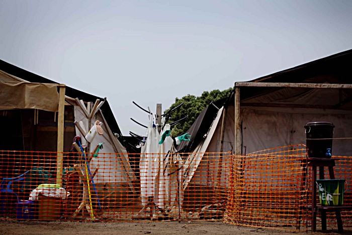 An Ebola emergency centre stands empty at the entrance to the district hospital in Magburaka in Sierra Leone’s Northern Province, 200km from Freetown. Magburaka saw its last outbreak of Ebola in January, when a 22-year-old girl died from the disease.