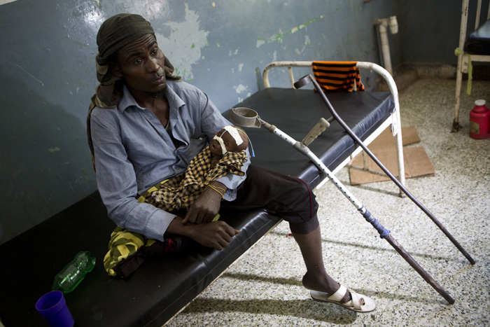 Ali Hassan Mohamed Hassan, 38, who lost his leg years ago in a roadside bomb, walked for three weeks from his village to Somalia’s capital Mogadishu after all his livestock died in the drought. His six month old son Mohamed contracted cholera during the journey and is now receiving emergency treatment in Banadir hospital, Mogadishu.