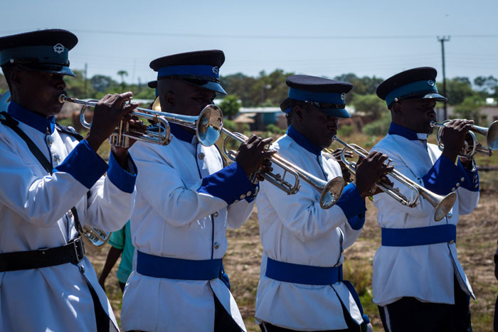 The Mazabuka Police Brass band leads a crowd to the rotavirus vaccine launch site at Kaleya Clinic in Mazabuka Province. Mazabuka is the pilot district for Zambia’s national launch of the GAPPD, the WHO and UNICEF plan that includes rotavirus vaccination as part of a comprehensive strategy to prevent and control diarrhoea and pneumonia.