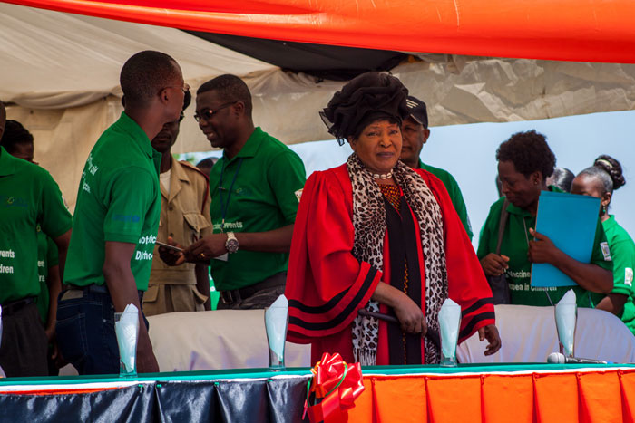 Her Royal Highness Chieftainess Mwenda of the Mazabuka District looks on as the marchers arrive at the Kaleya Clinic ground and prepares to welcome the crowd.