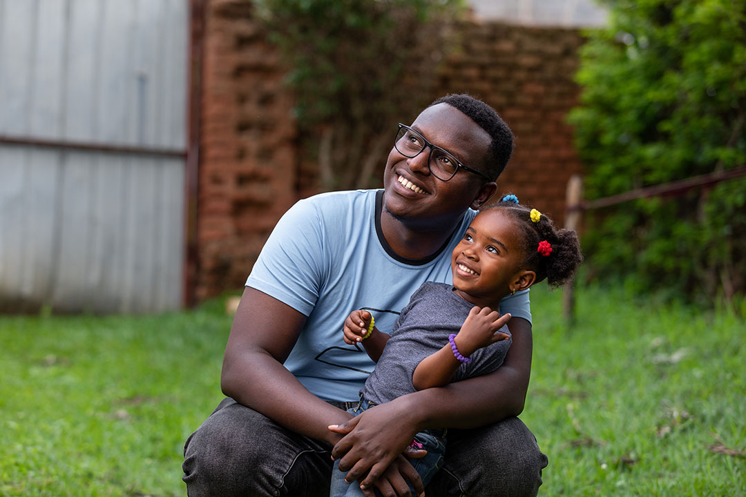Olivier (29 years old) holding his daughter Krystal (4 years old) at their home located in Kigali, Rwanda. Credit: Gavi/2023/Isaac Nkinzingabo RUDAKUBANA