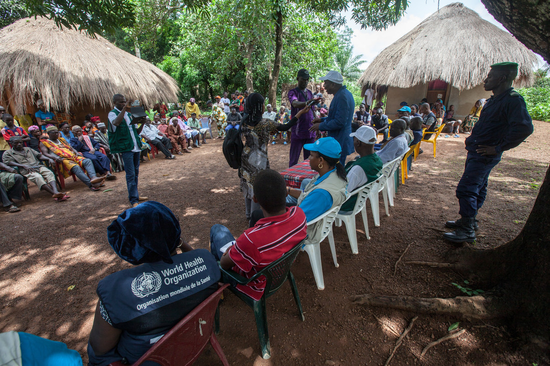 Dr. Sakoba Keita, coordinator of the Guinean Ebola Response speaks to local media during a village meeting on Ebola. The World Health Organisation ran phase III clinical trials for ebola virus disease vaccine in Guinea. Credit: Gavi/2015/Sean Hawkey.