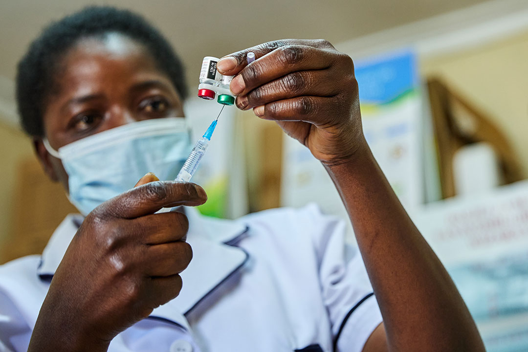 Nurse Janet Wanyama prepares to vaccinate a child against malaria at the Malava County Hospital, Kakamega, Kenya. Credit: Gavi/2021/White Rhino Films-Lameck Orina