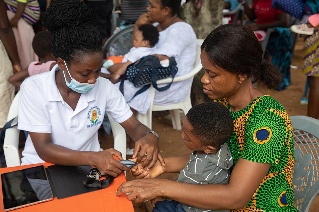 Biometric identification of a mother is collected into a new computerised database during a community health check-up and vaccination in Akosombo in the Eastern Region, Ghana, on April 28, 2022. Gavi/2022/Nipah Dennis