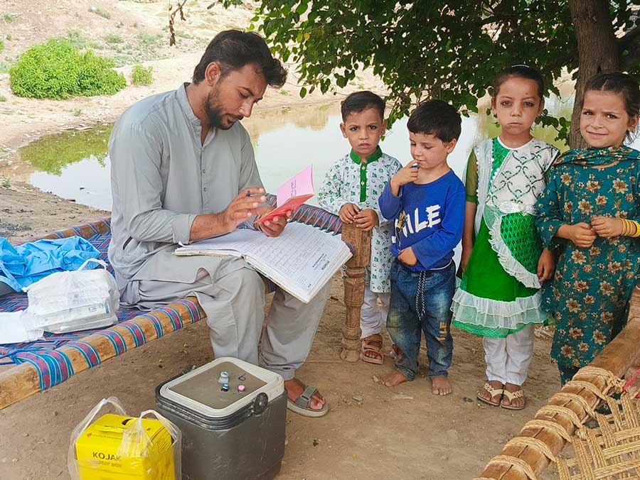 An EPI vaccinator records data while immunising children in Jatta Ismail Khel, Karak District, Khyber-Pakhtunkhwa, Pakistan. Photo credit: Medical Emergency Resilience Foundation (MERF)/2025