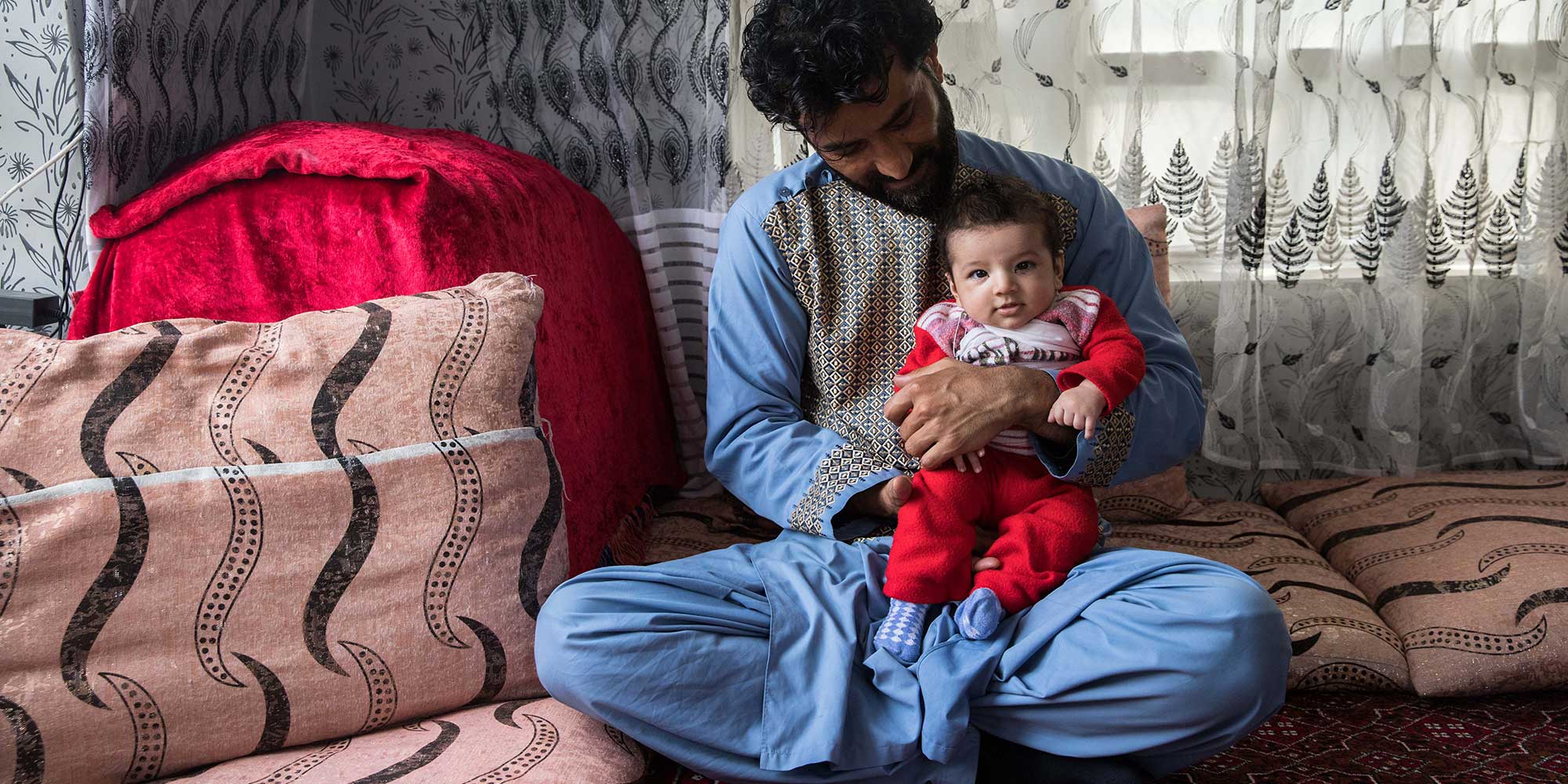 Ajmal Sediqqi, 37, lives in Kabul, Afghanistan, and is the father of 3 children. He owns a grocery store. He and his wife have been vaccinated against COVID-19. All of his children have been vaccinated against DTP and polio. "Vaccines ward off disease." 3-month-old Arkan received a first dose three days earlier. Gavi/2023/Oriane Zerah