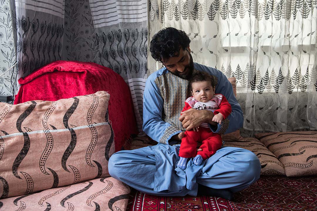 Ajmal Sediqqi, 37, lives in Kabul, Afghanistan, and is the father of 3 children. He owns a grocery store. He and his wife have been vaccinated against COVID-19. All of his children have been vaccinated against DTP and polio. "Vaccines ward off disease." 3-month-old Arkan received a first dose three days earlier. Gavi/2023/Oriane Zerah